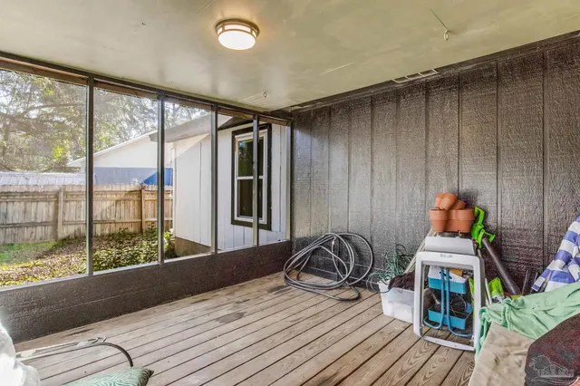 a bedroom with furniture and a window