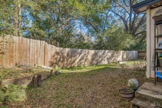 a backyard of a house with lots of green space