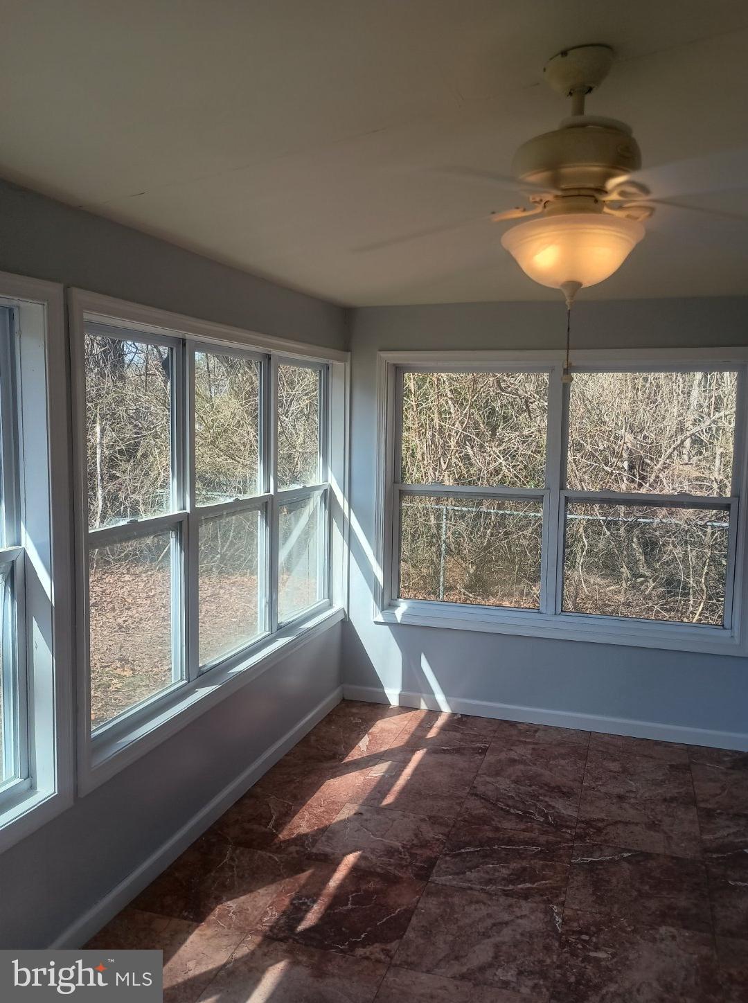 138 Jute Road Millville, NJ 08332 - Photo 6 of 12 a view of an empty room with a window