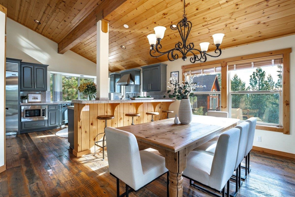 12391 Stockholm Way Truckee, CA 96161 - Photo 11 of 28 a view of a dining room with furniture window and wooden floor