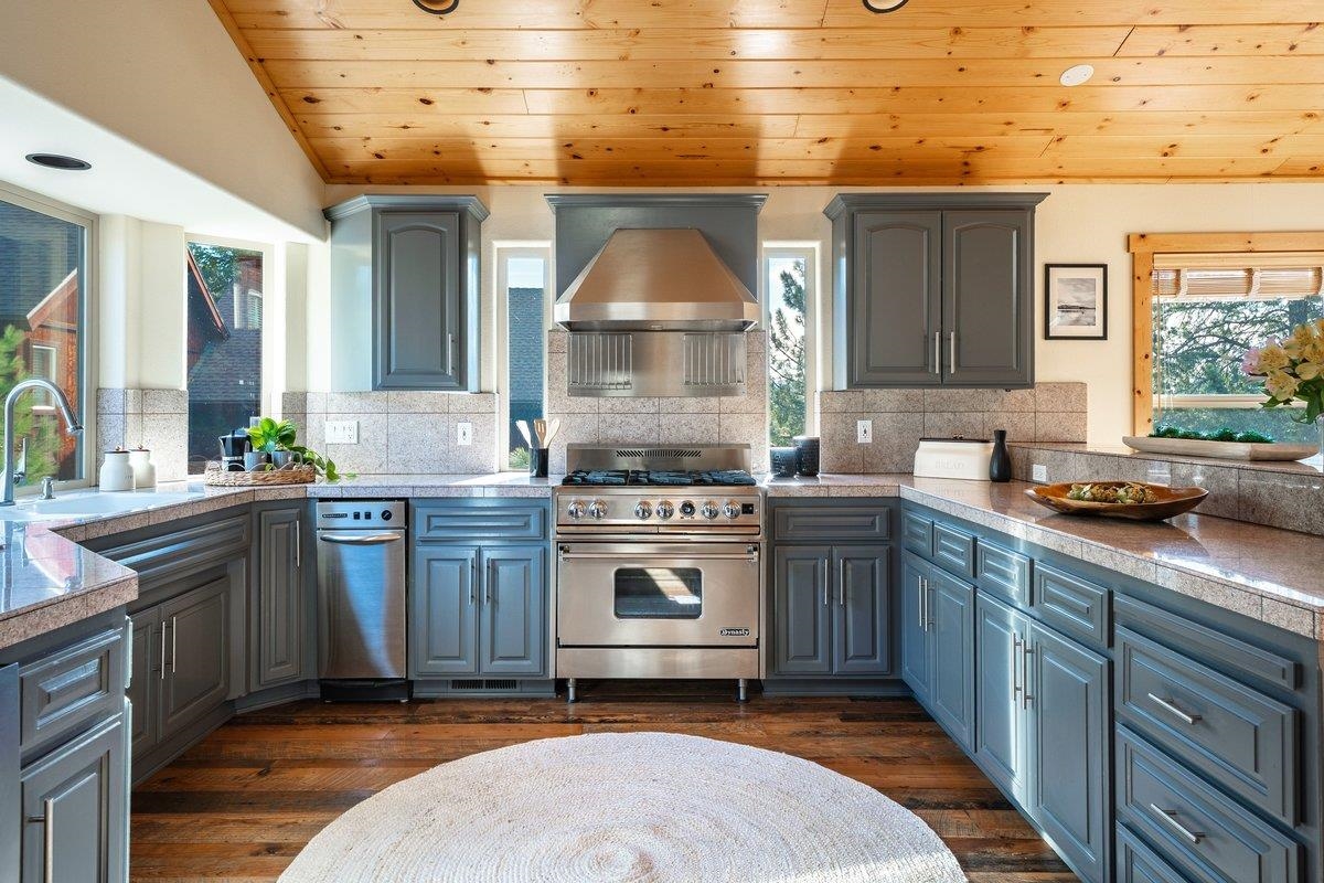 12391 Stockholm Way Truckee, CA 96161 - Photo 13 of 28 a kitchen with a sink stove and cabinets