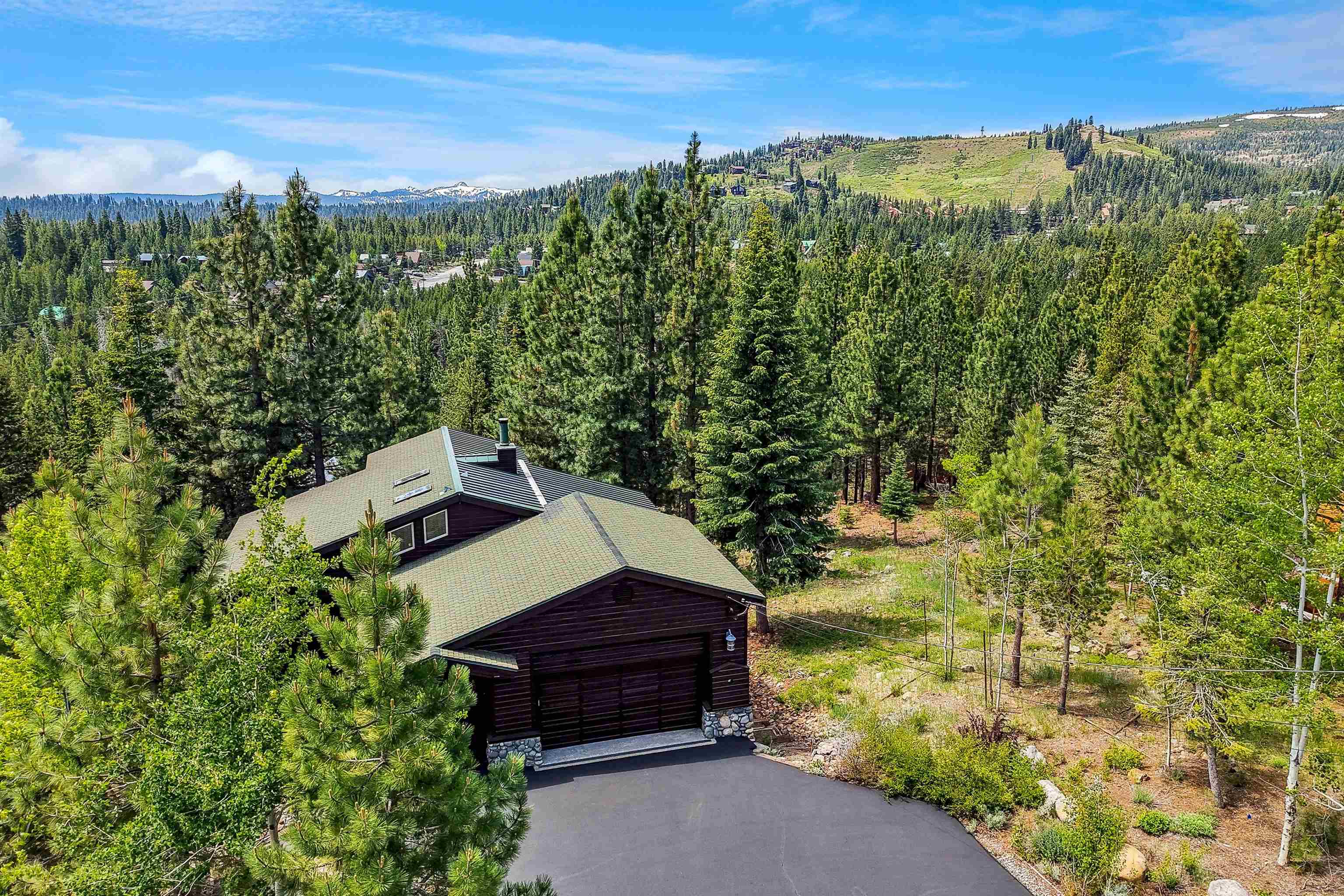 12391 Stockholm Way Truckee, CA 96161 - Photo 2 of 28 a view of a yard in front of a building