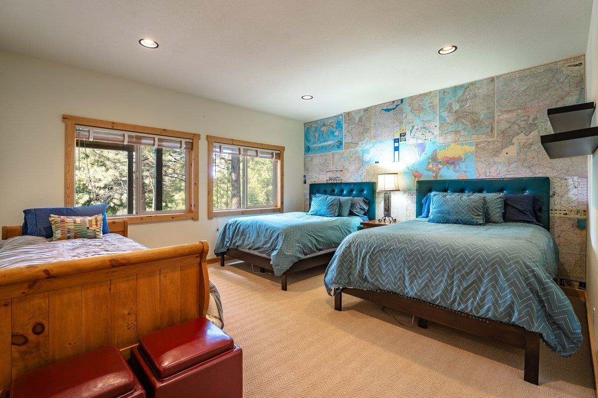 12391 Stockholm Way Truckee, CA 96161 - Photo 24 of 28 a bedroom with a bed and wooden floor