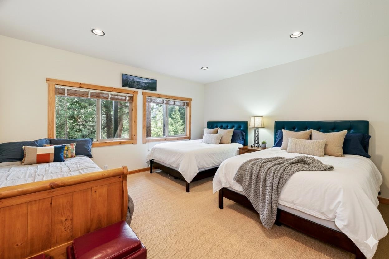 12391 Stockholm Way Truckee, CA 96161 - Photo 25 of 28 a bedroom with two beds and large windows