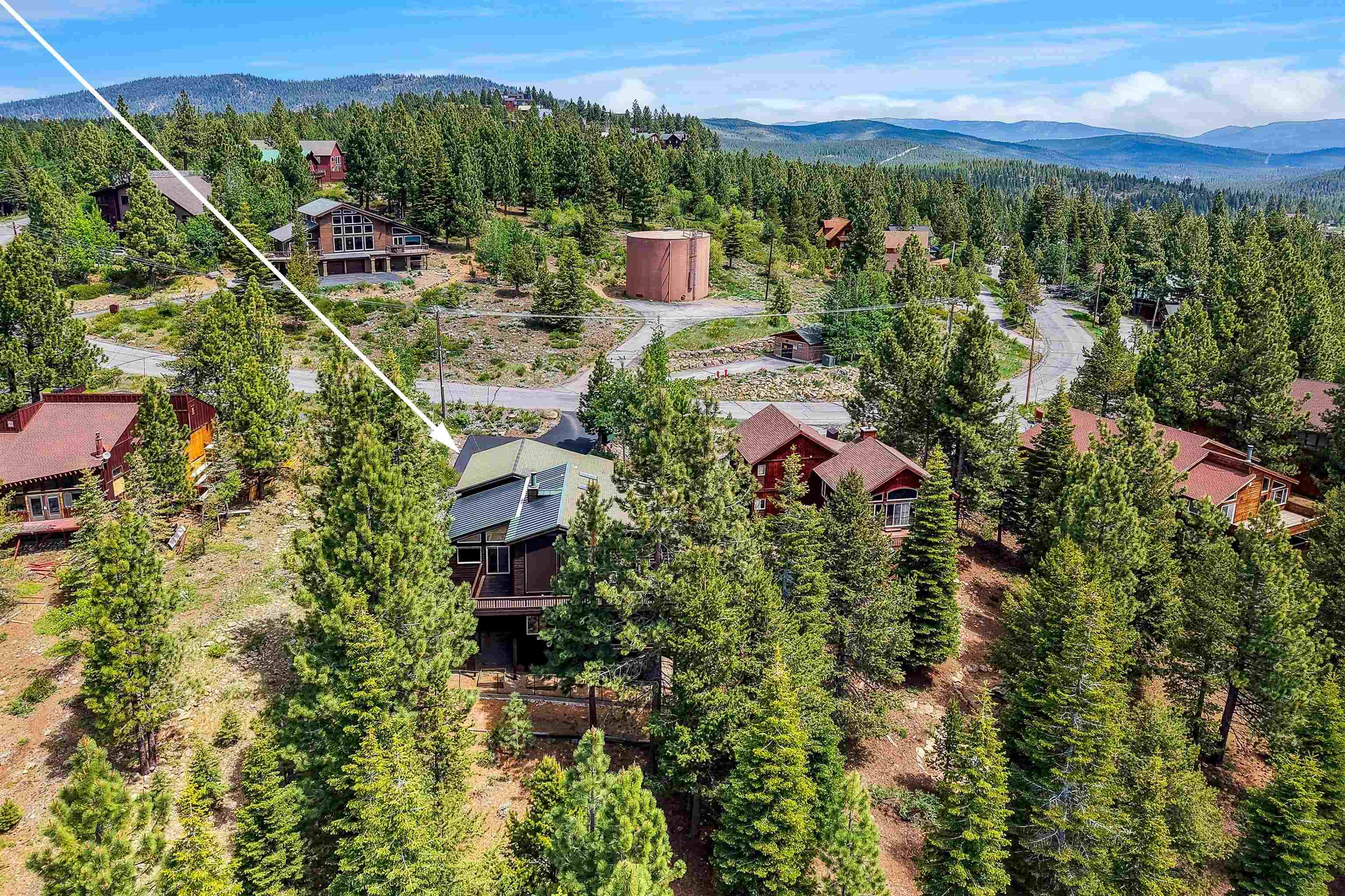 12391 Stockholm Way Truckee, CA 96161 - Photo 3 of 28 a view of a city with lush green forest