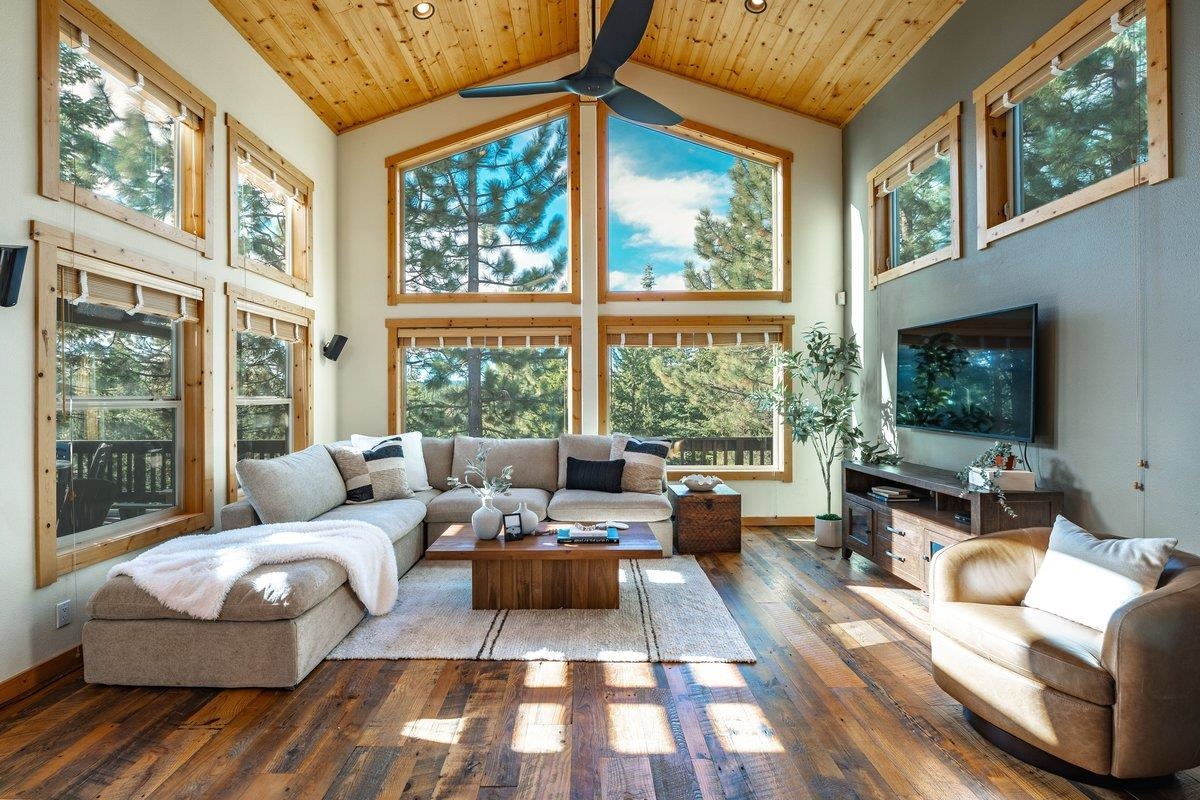 12391 Stockholm Way Truckee, CA 96161 - Photo 9 of 28 a living room with furniture and a flat screen tv