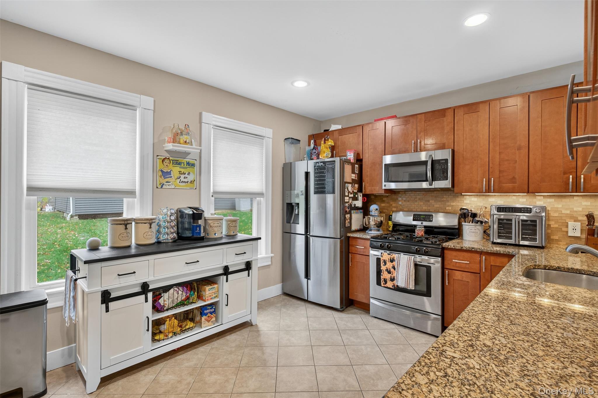 5 Bede Terrace Cornwall, NY 12518 - Photo 13 of 25 a kitchen with stainless steel appliances kitchen island granite countertop a refrigerator and a stove top oven