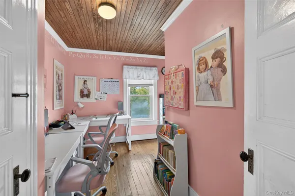 a view of a workspace with furniture and toys