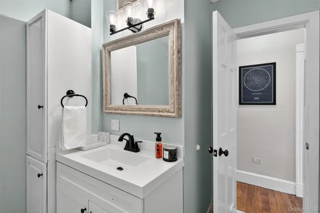 a bathroom with a sink and a mirror