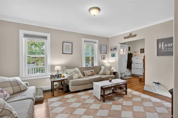 a living room with furniture and a window