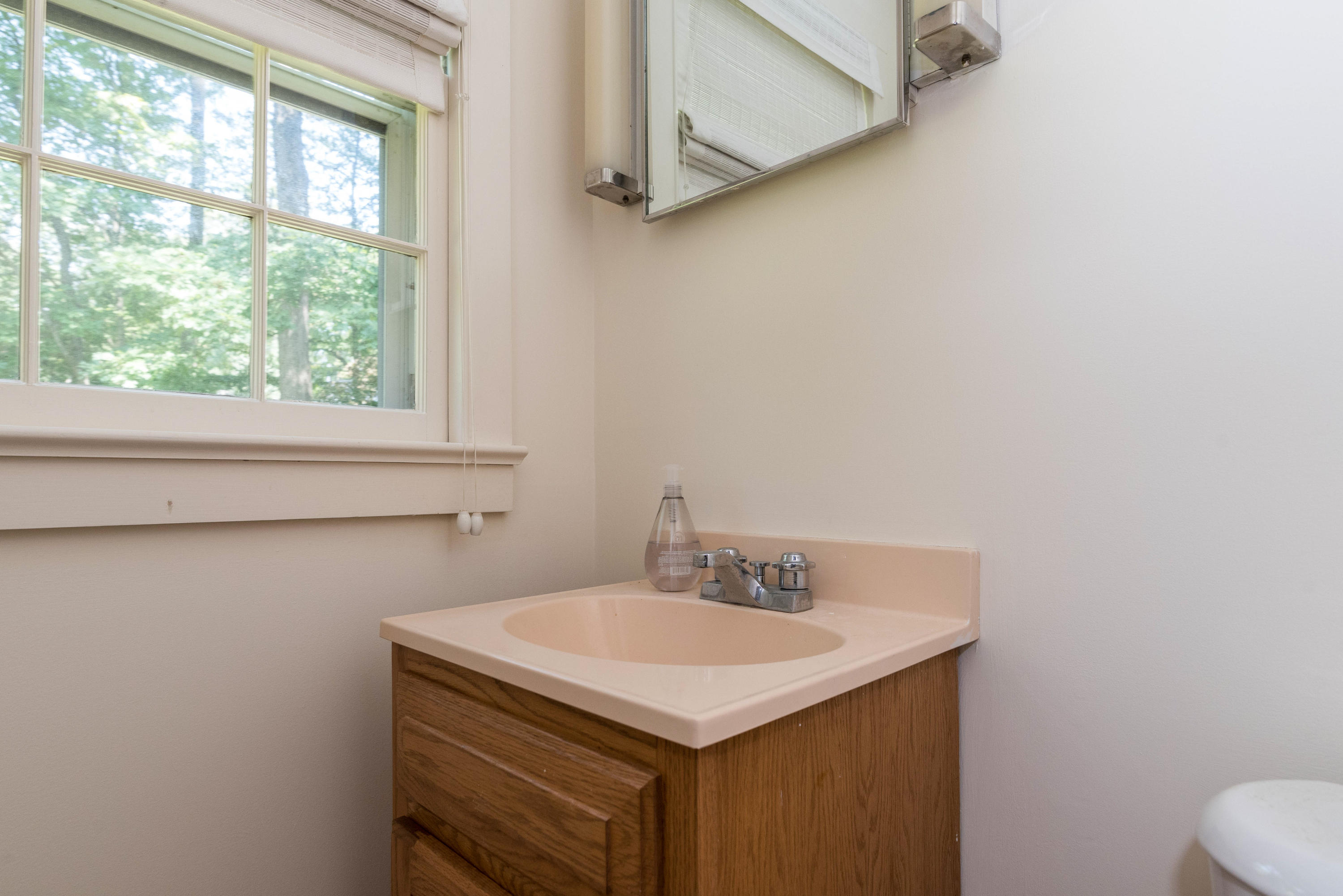 10 Rocaton Road Darien, CT 06820 - Photo 11 of 24 a bathroom with a sink and a toilet