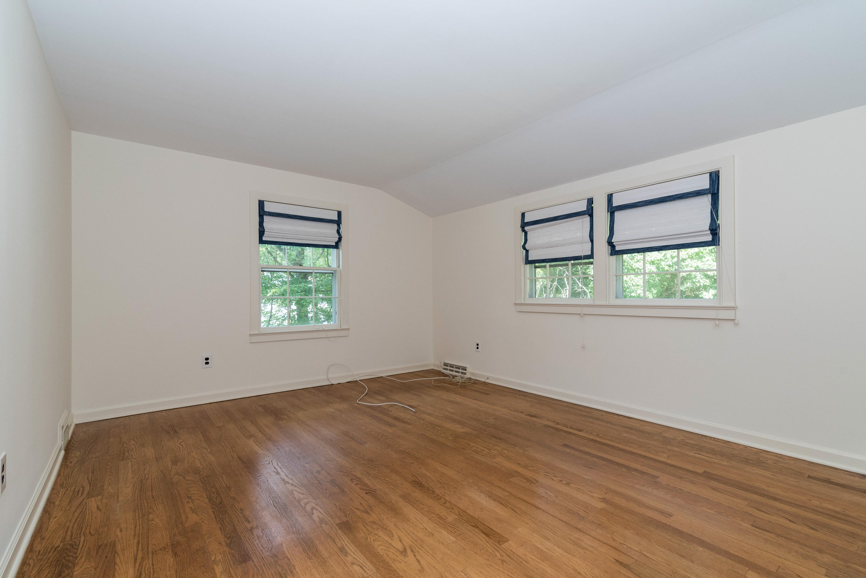 10 Rocaton Road Darien, CT 06820 - Photo 16 of 24 a view of an empty room with wooden floor and a window