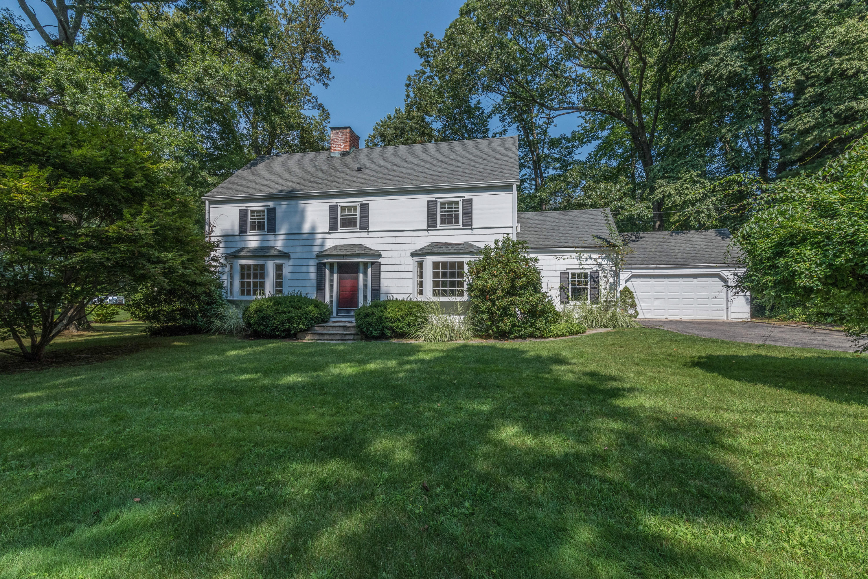 10 Rocaton Road Darien, CT 06820 - Photo 3 of 24 a aerial view of a house with a yard table and chairs