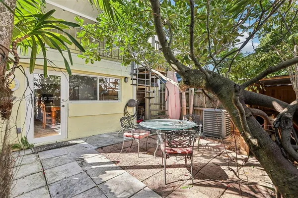 a house with trees in front of it