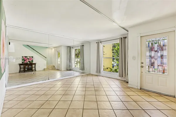 a view of an entryway with window and furniture