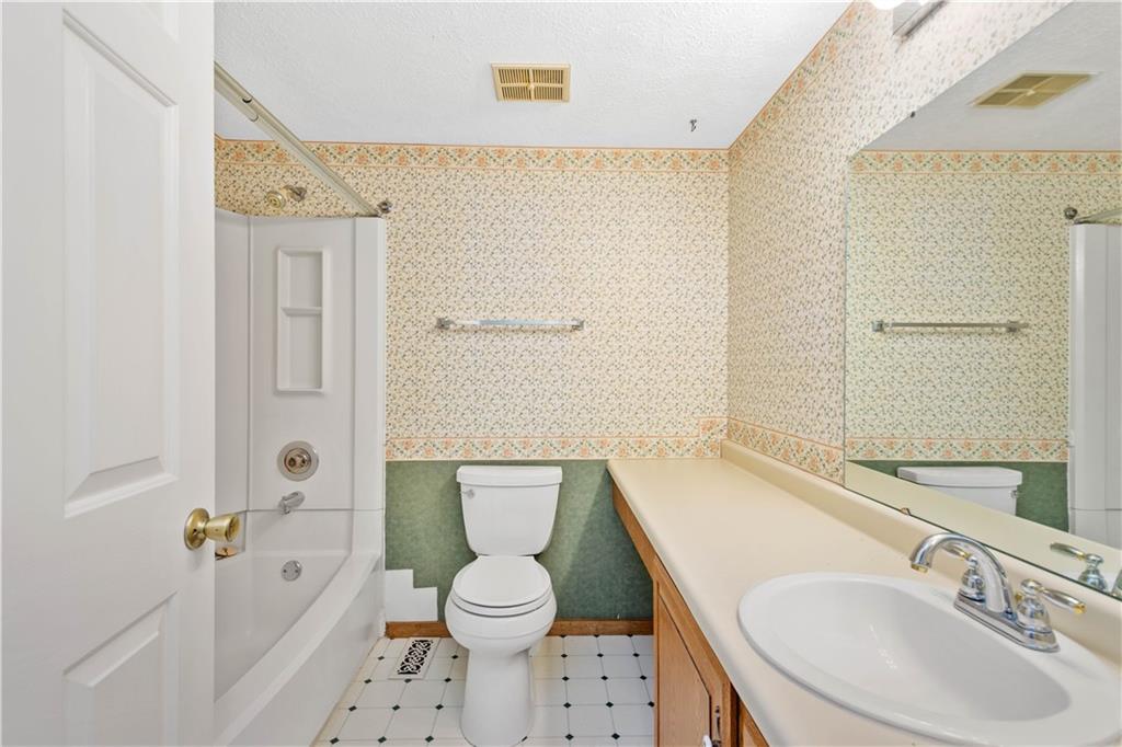 157 Valley View Road Eighty Four, PA 15330 - Photo 12 of 25 a bathroom with a toilet a sink and a bathtub