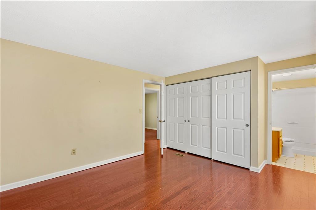 157 Valley View Road Eighty Four, PA 15330 - Photo 14 of 25 an empty room with wooden floor and closet