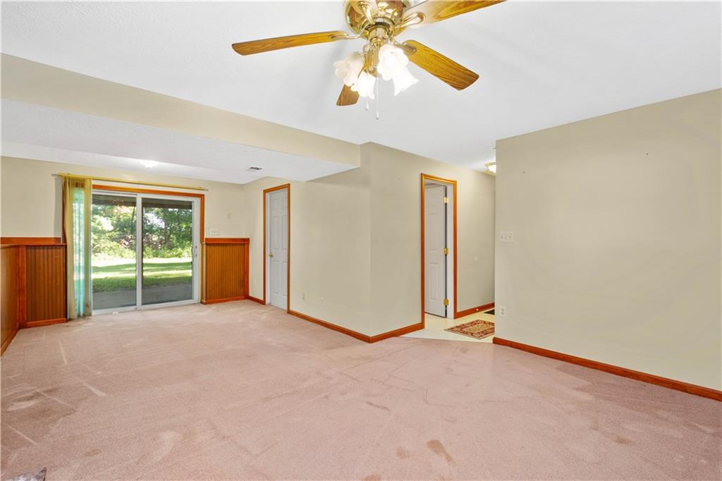 157 Valley View Road Eighty Four, PA 15330 - Photo 19 of 25 a view of an empty room with a window and kitchen view