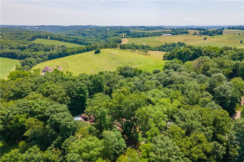 157 Valley View Road Eighty Four, PA 15330 - Photo 21 of 25 an aerial view of green landscape with trees houses and lake view