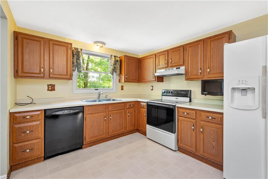 157 Valley View Road Eighty Four, PA 15330 - Photo 5 of 25 a kitchen with stainless steel appliances granite countertop a stove sink and cabinets