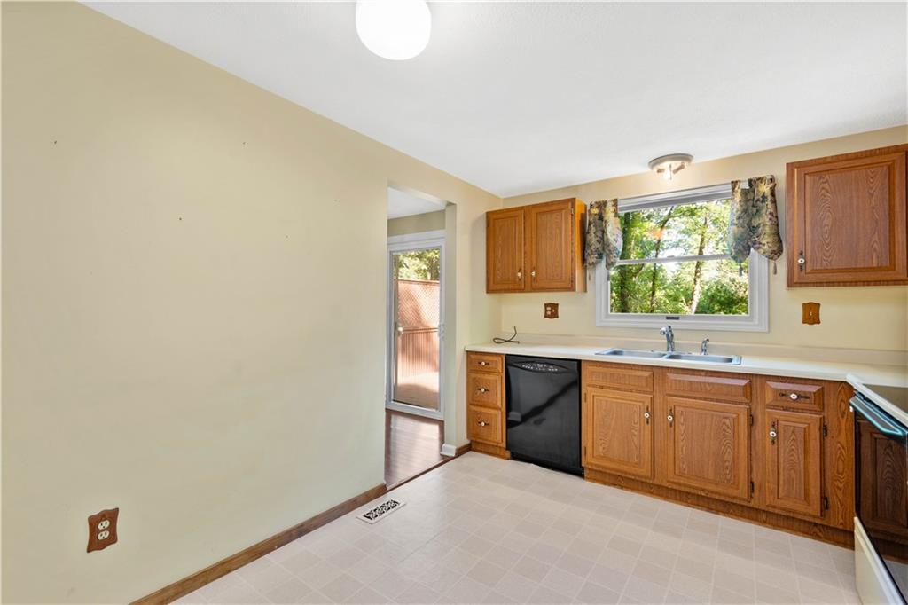 157 Valley View Road Eighty Four, PA 15330 - Photo 6 of 25 a kitchen with a sink cabinets appliances and a window