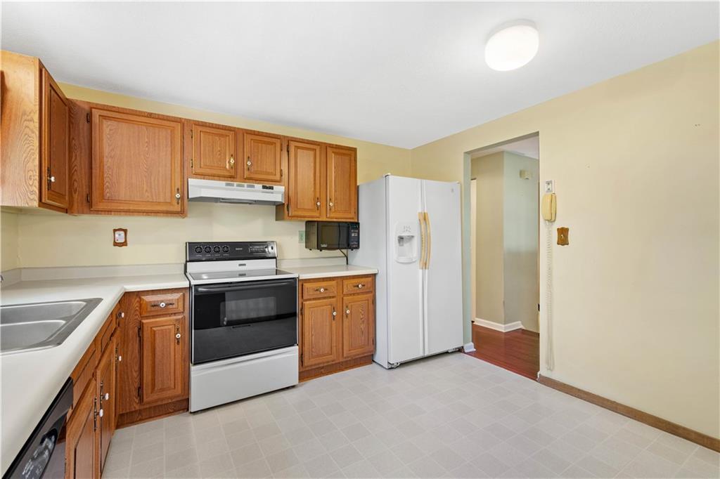 157 Valley View Road Eighty Four, PA 15330 - Photo 7 of 25 a kitchen with stainless steel appliances granite countertop a sink stove and refrigerator