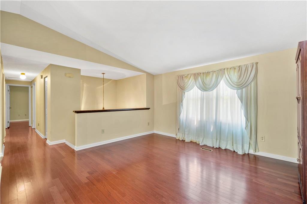 157 Valley View Road Eighty Four, PA 15330 - Photo 10 of 25 a view of an empty room with wooden floor and a window