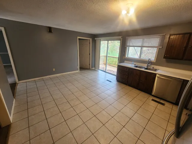 a view of kitchen with furniture and window