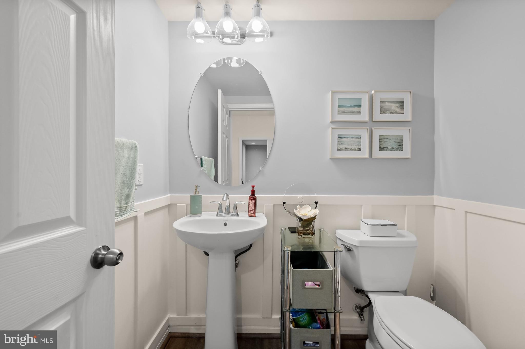 3515 Doc Berlin Drive Silver Spring, MD 20906 - Photo 15 of 49 a bathroom with a toilet sink and mirror