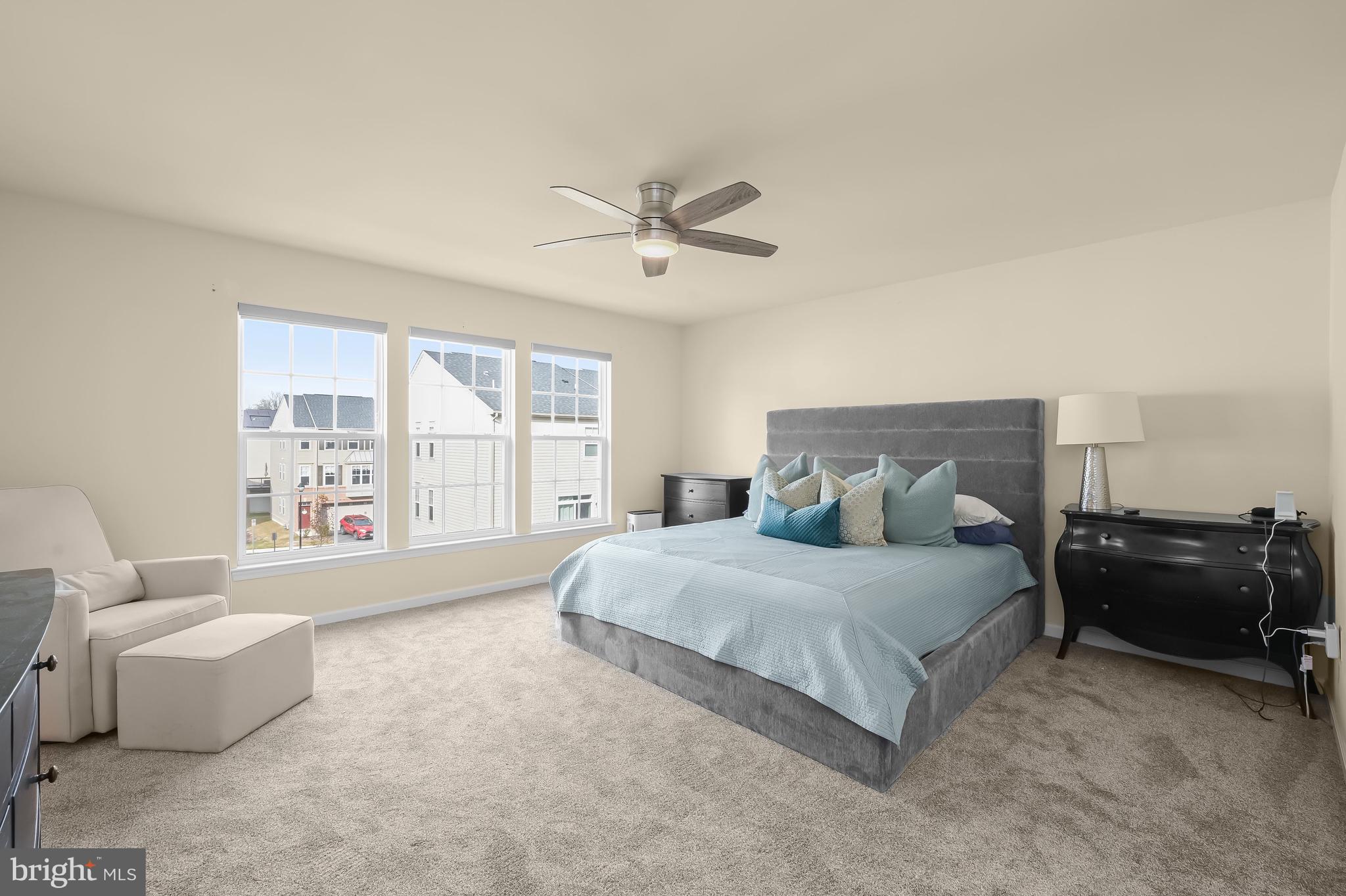 3515 Doc Berlin Drive Silver Spring, MD 20906 - Photo 18 of 49 a spacious bedroom with a bed and a couch