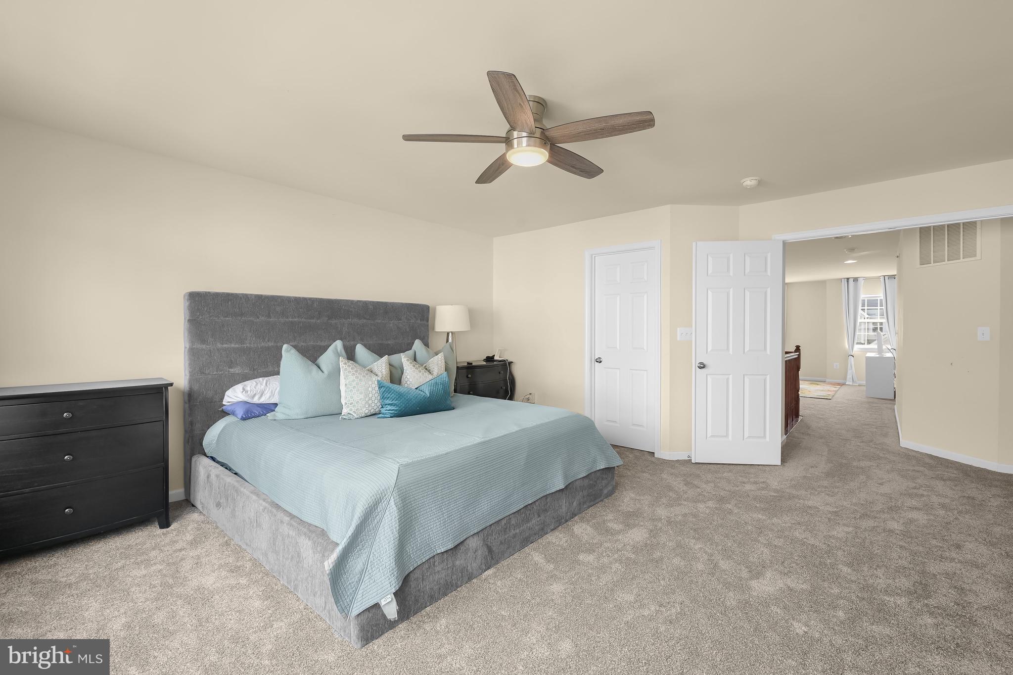3515 Doc Berlin Drive Silver Spring, MD 20906 - Photo 19 of 49 a spacious bedroom with a bed and cabinet