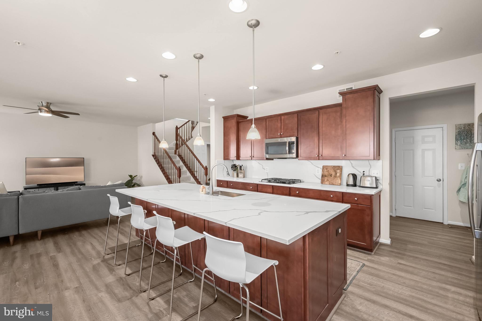 3515 Doc Berlin Drive Silver Spring, MD 20906 - Photo 2 of 49 a very nice looking kitchen with a wooden floor and a refrigerator