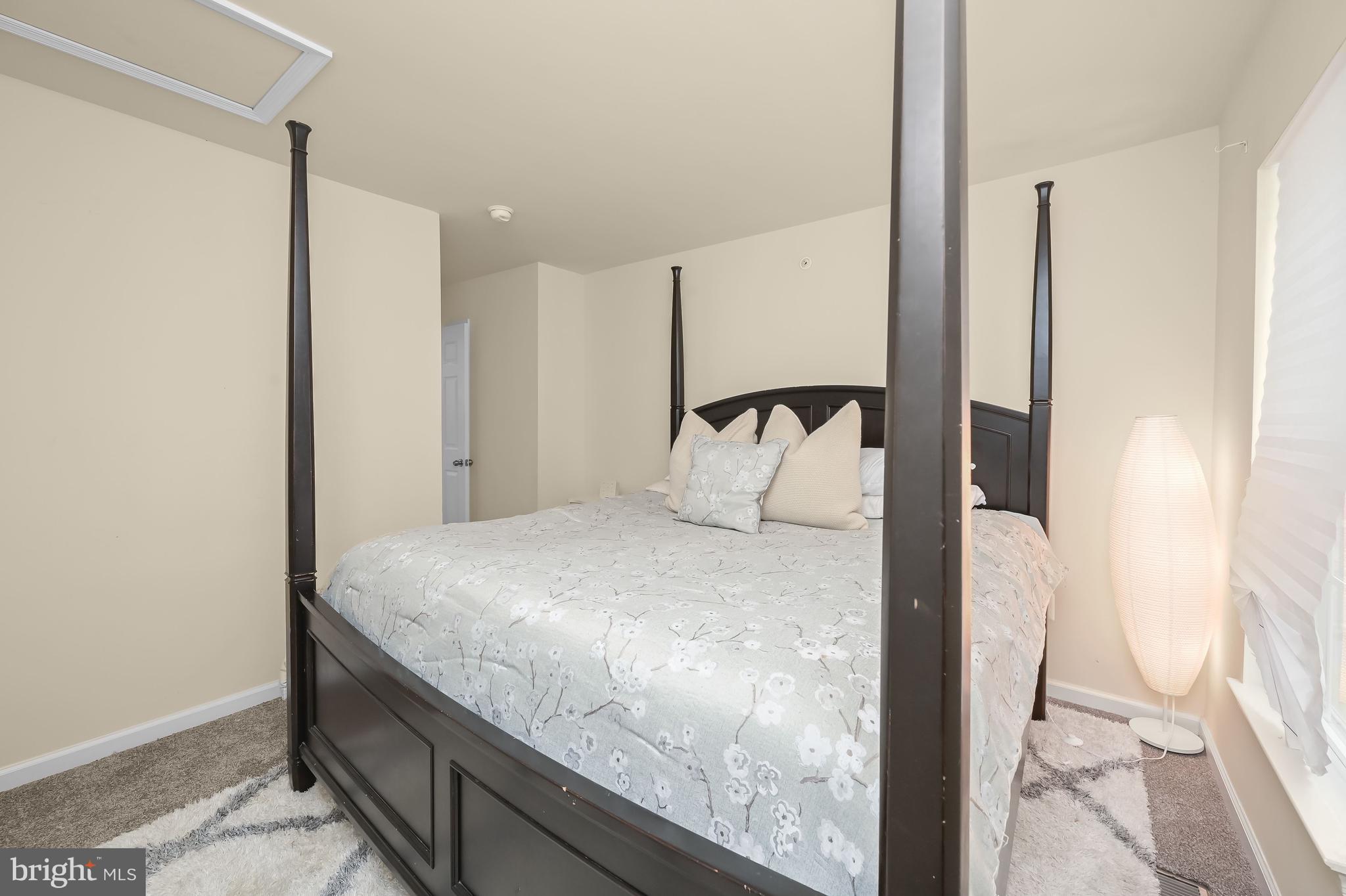 3515 Doc Berlin Drive Silver Spring, MD 20906 - Photo 23 of 49 a bedroom with a bed and a mirror