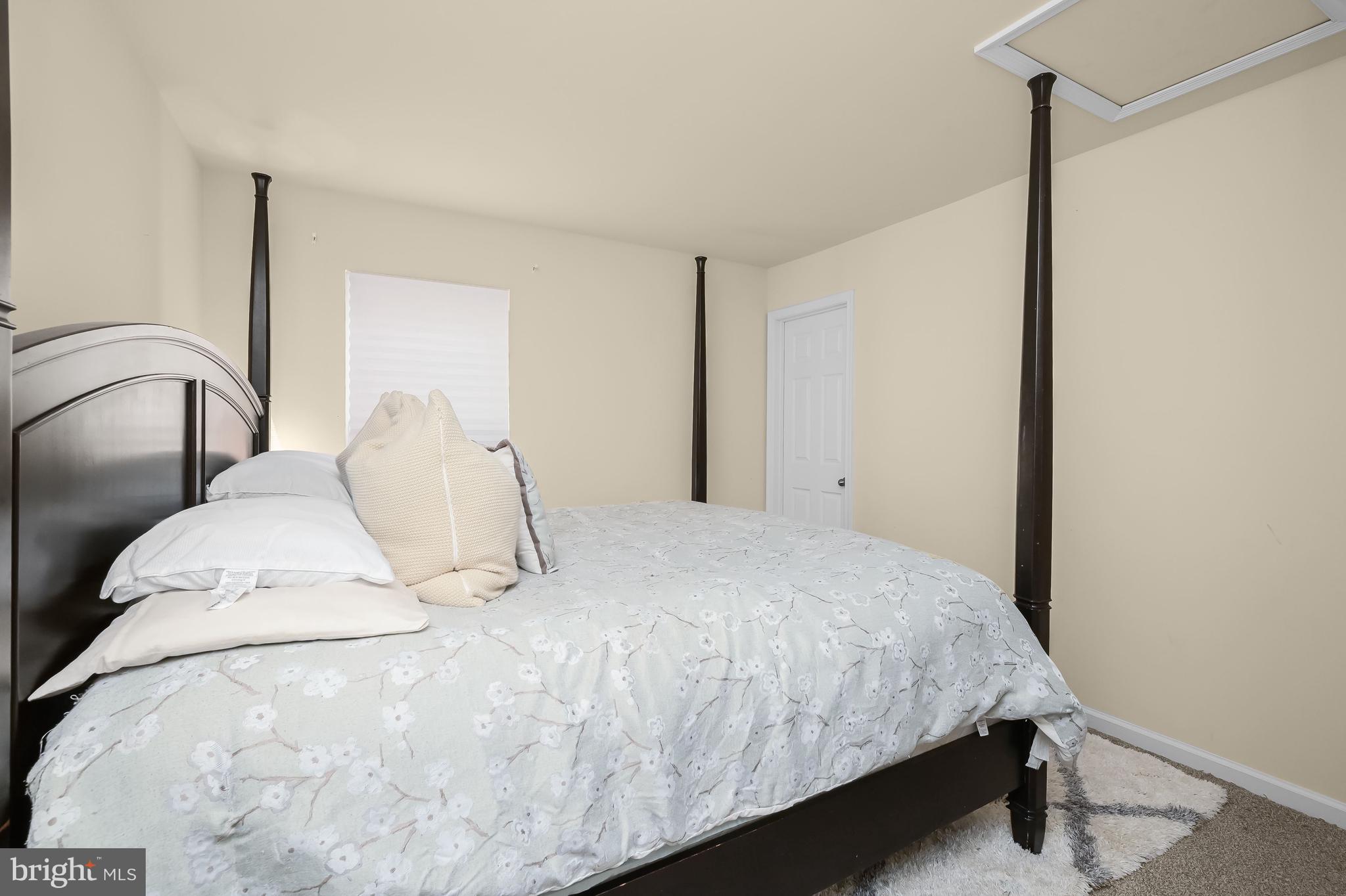 3515 Doc Berlin Drive Silver Spring, MD 20906 - Photo 24 of 49 a bedroom with a bed and a night stand