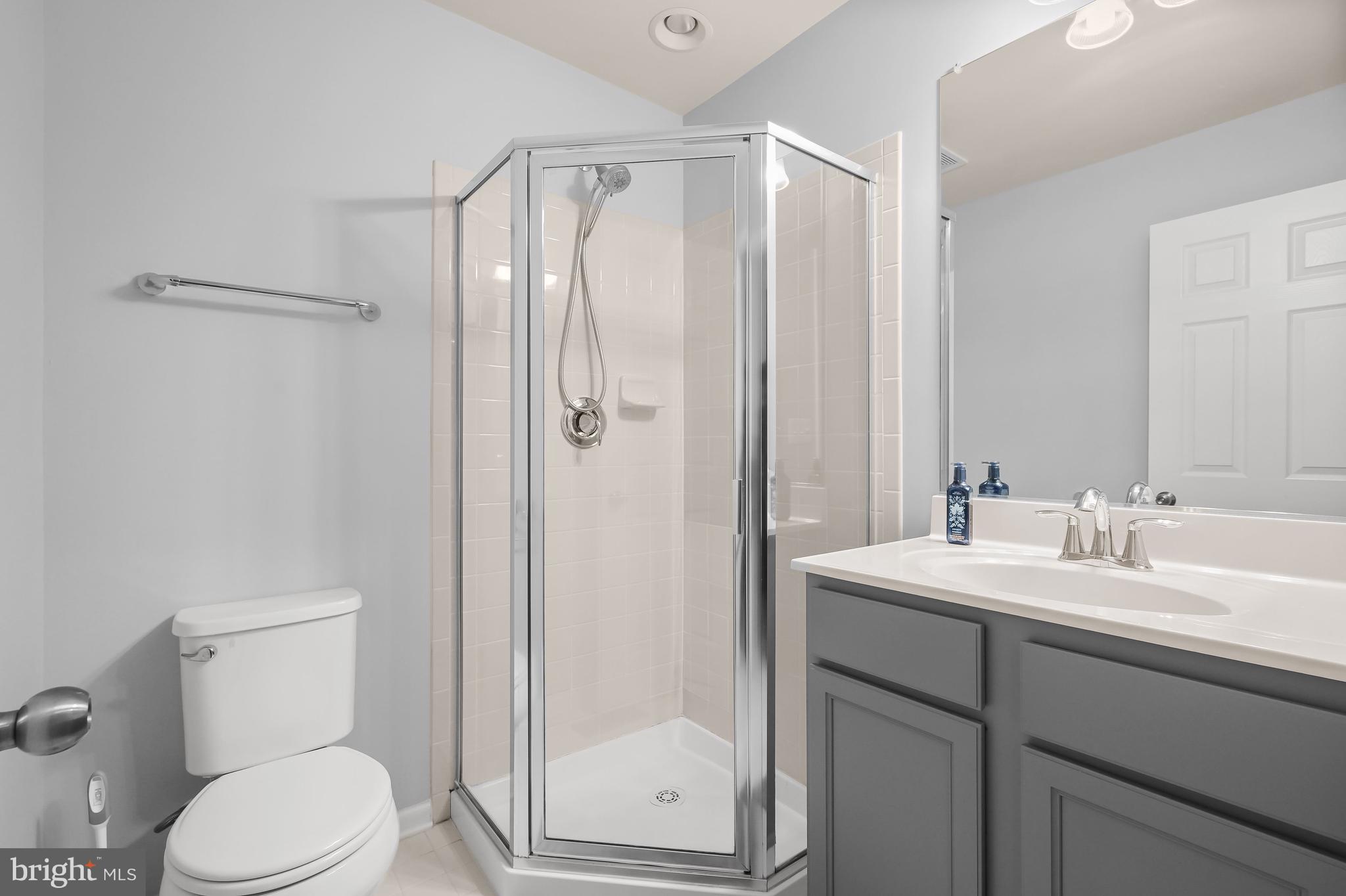 3515 Doc Berlin Drive Silver Spring, MD 20906 - Photo 25 of 49 a bathroom with a shower sink vanity mirror and toilet