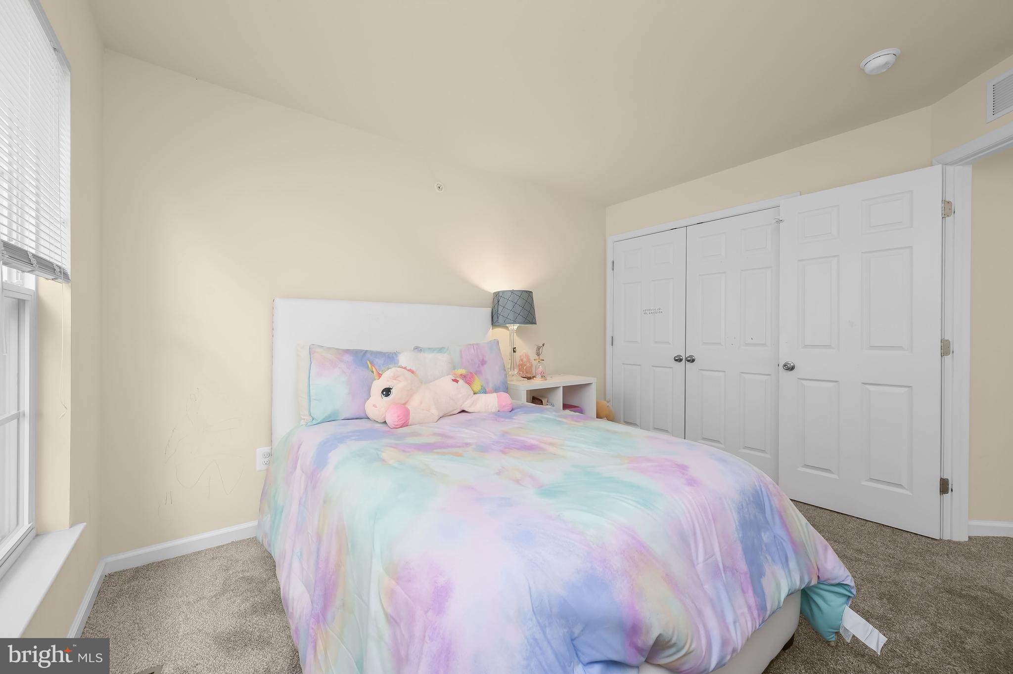 3515 Doc Berlin Drive Silver Spring, MD 20906 - Photo 29 of 49 a bedroom with a bed and a window