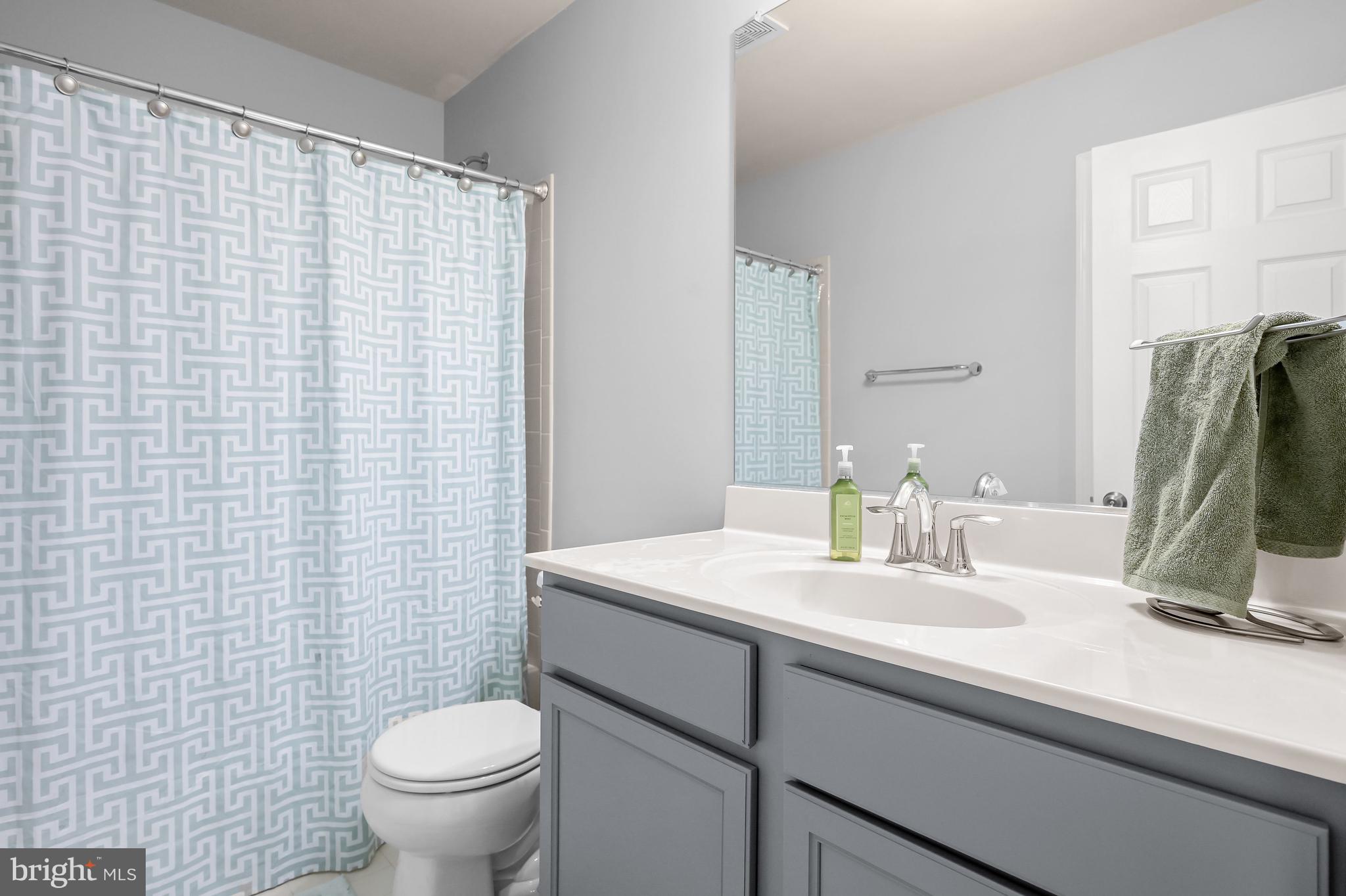 3515 Doc Berlin Drive Silver Spring, MD 20906 - Photo 30 of 49 a bathroom with a sink toilet and mirror