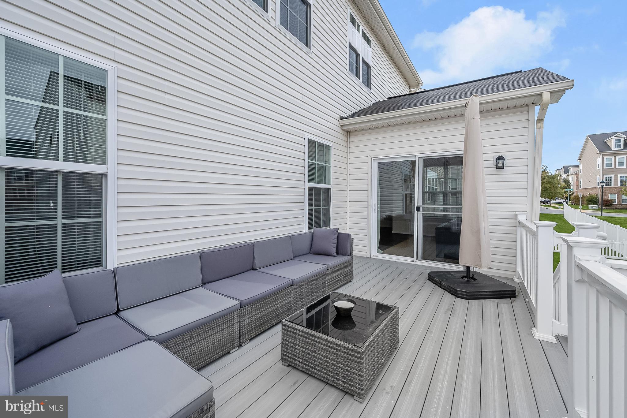 3515 Doc Berlin Drive Silver Spring, MD 20906 - Photo 39 of 49 a view of a patio with couches and a patio with wooden floor