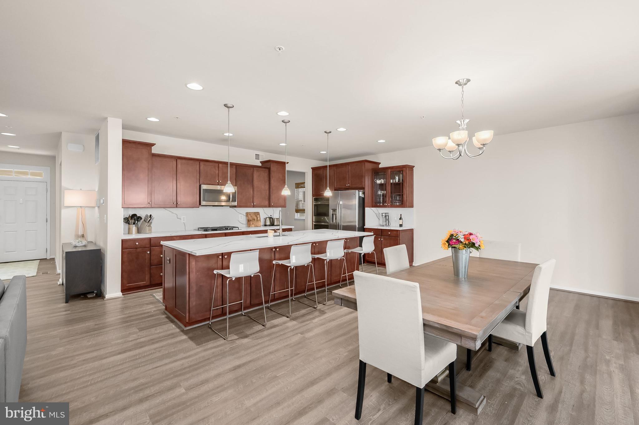 3515 Doc Berlin Drive Silver Spring, MD 20906 - Photo 6 of 49 a kitchen with a dining table chairs and wooden floor