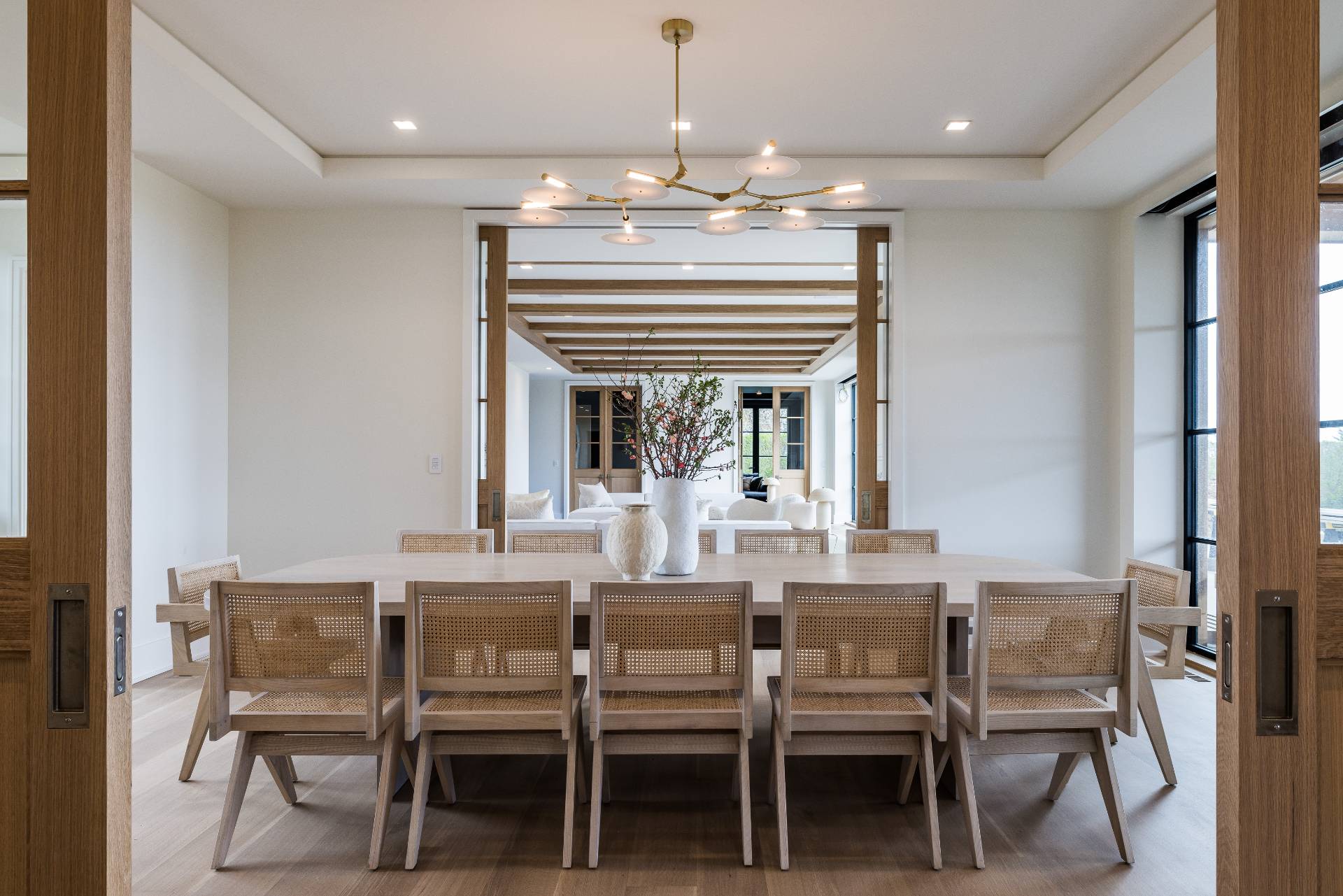 Undisclosed Address Sagaponack, NY 11962 - Photo 12 of 40 a dining room with furniture a chandelier and window