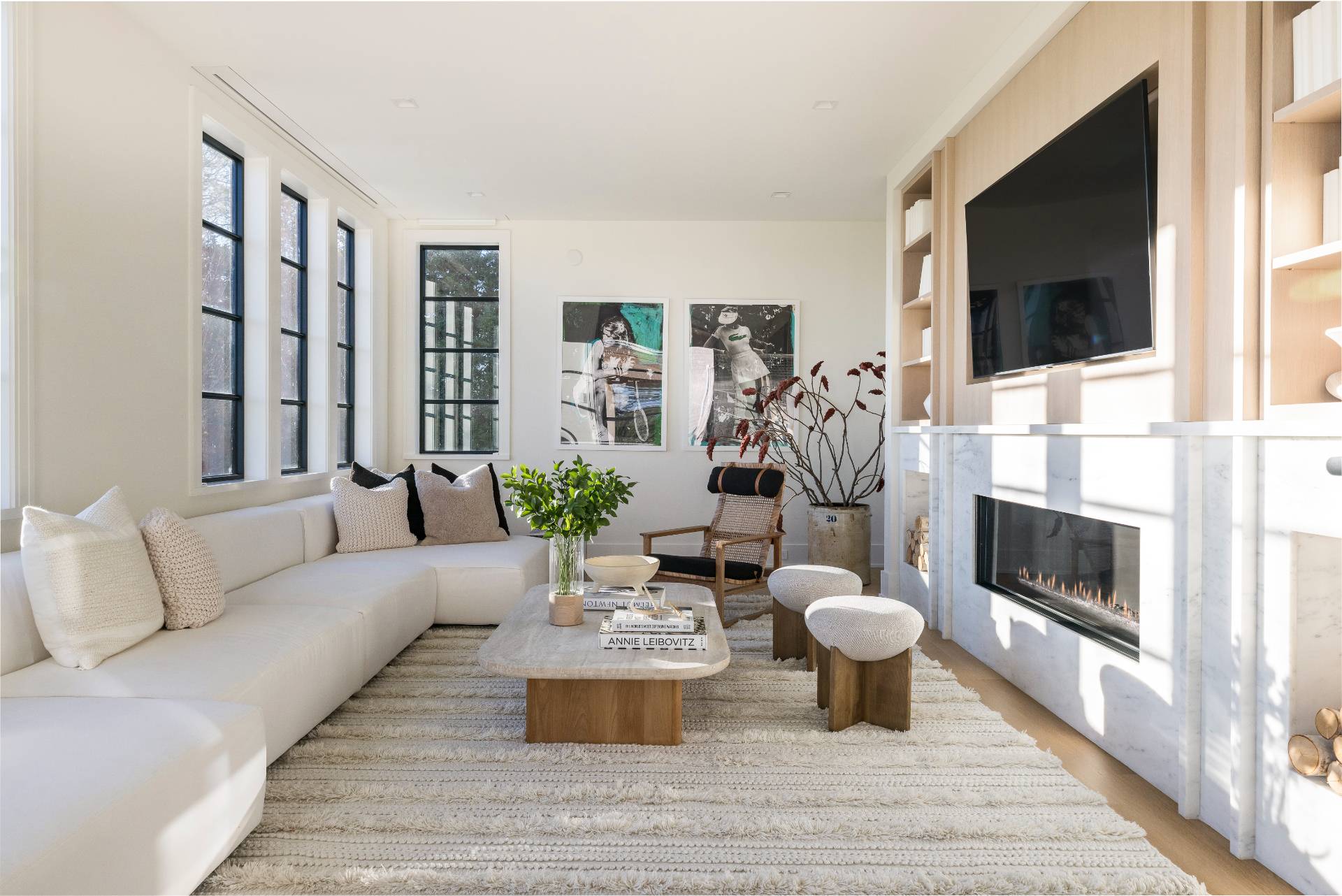 Undisclosed Address Sagaponack, NY 11962 - Photo 13 of 40 a living room with furniture a flat screen tv and a fireplace