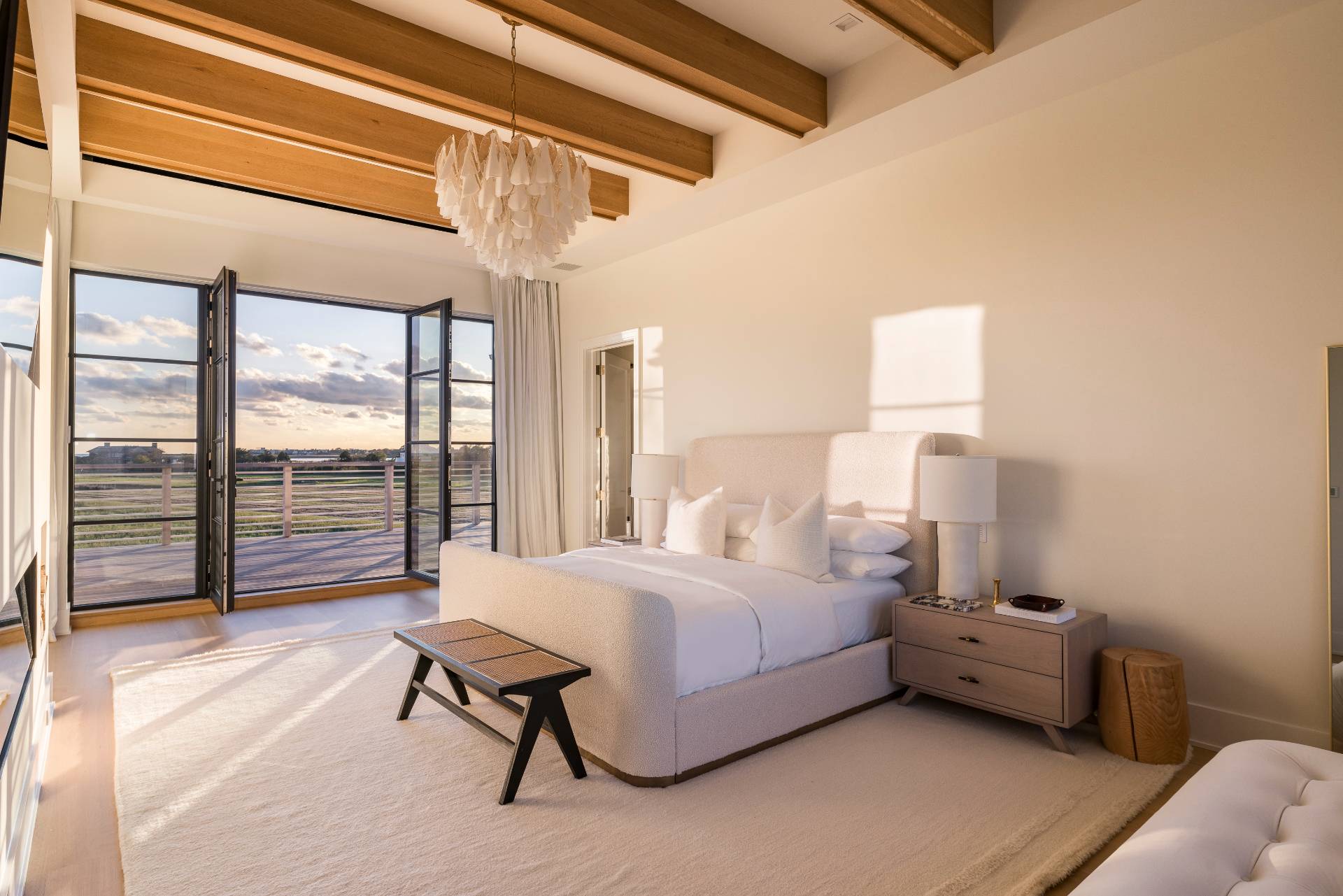 Undisclosed Address Sagaponack, NY 11962 - Photo 15 of 40 a bedroom with furniture and a large window