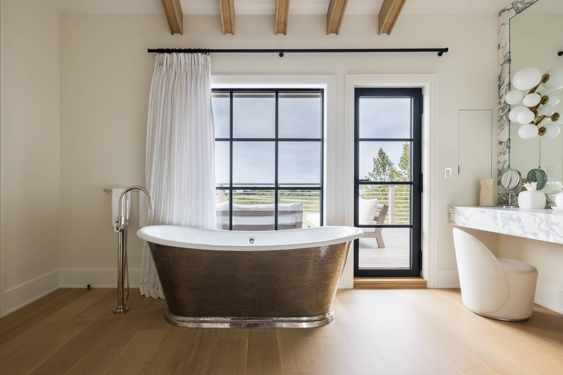 Undisclosed Address Sagaponack, NY 11962 - Photo 18 of 40 a white bath tub sitting in a bathroom