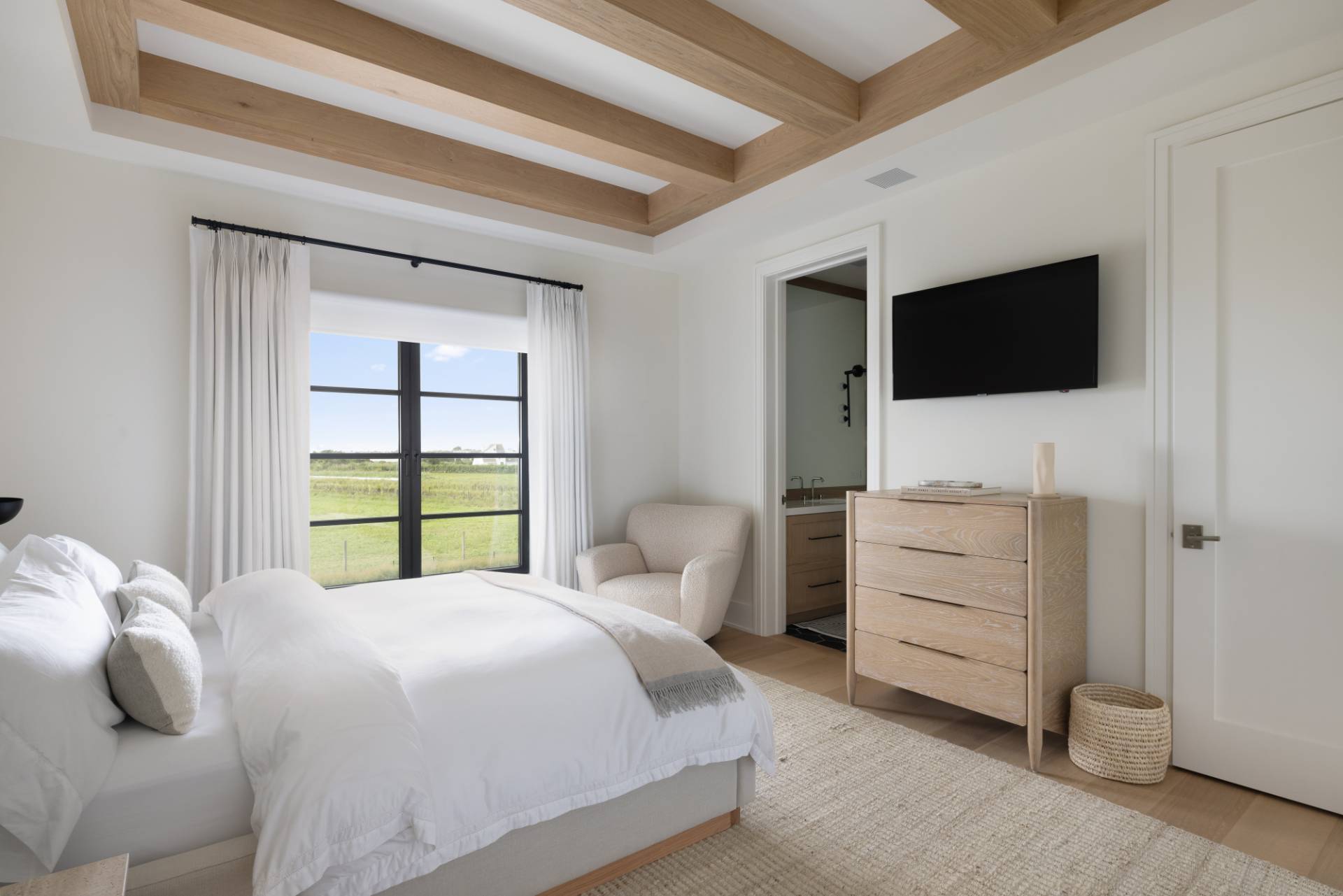 Undisclosed Address Sagaponack, NY 11962 - Photo 24 of 40 a bedroom with a bed and a flat screen tv