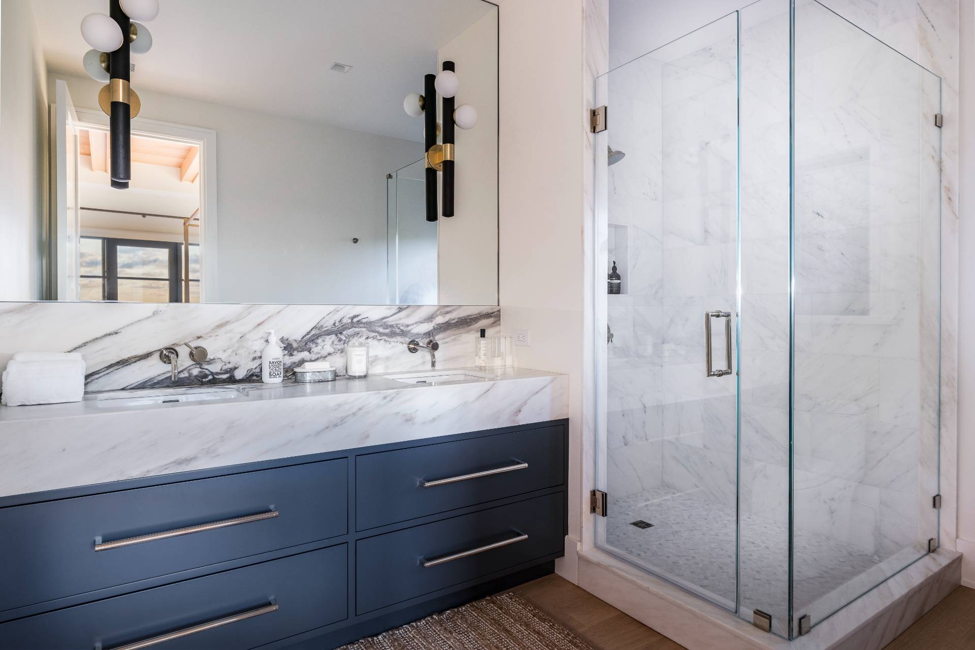 Undisclosed Address Sagaponack, NY 11962 - Photo 25 of 40 a bathroom with a granite countertop sink and a mirror