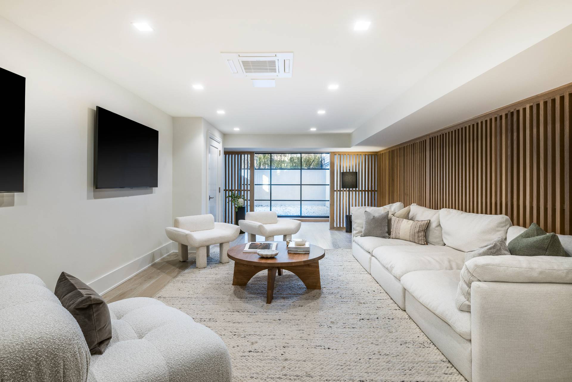 Undisclosed Address Sagaponack, NY 11962 - Photo 29 of 40 a living room with furniture and a flat screen tv