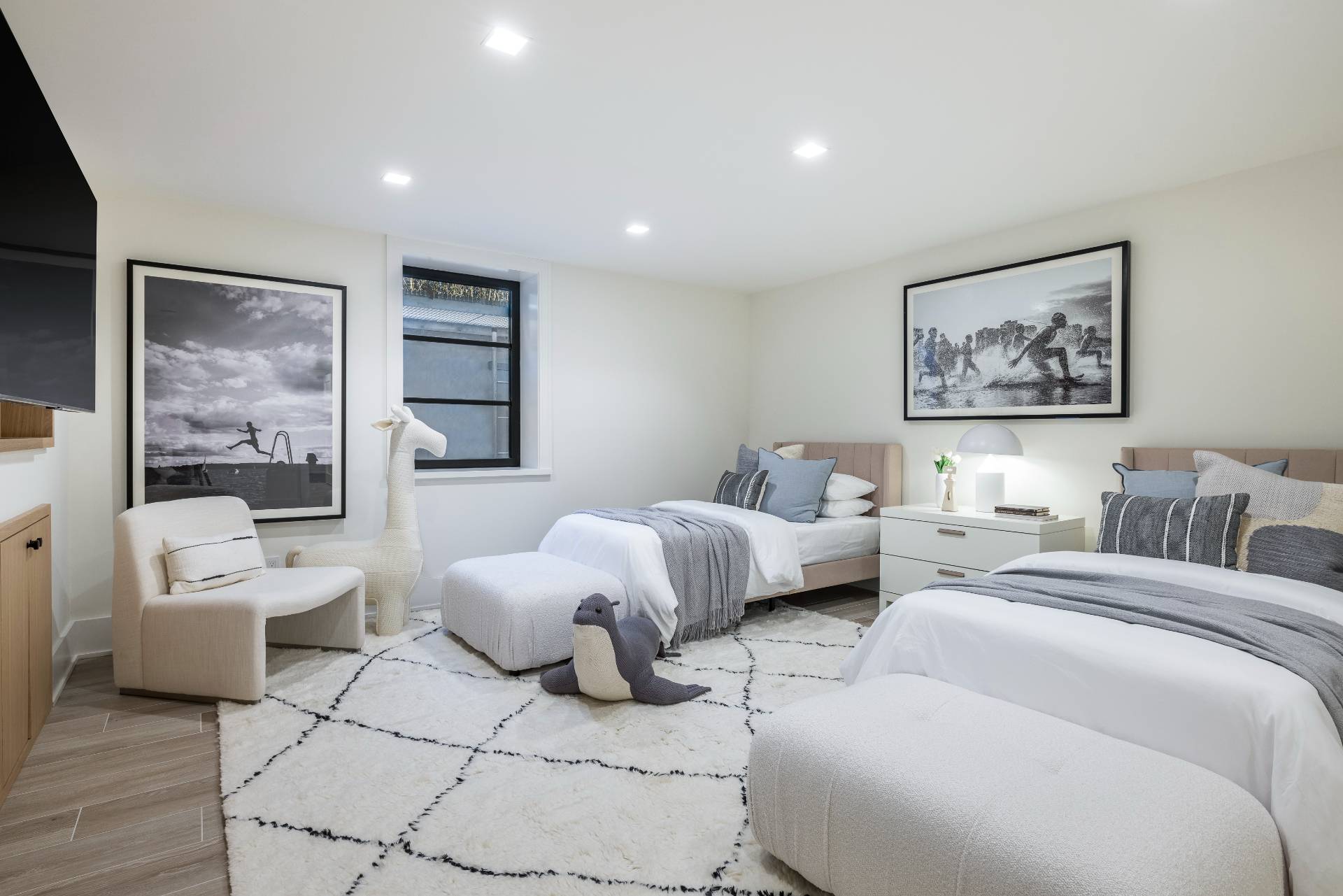 Undisclosed Address Sagaponack, NY 11962 - Photo 31 of 40 a spacious bedroom with two beds and a couch