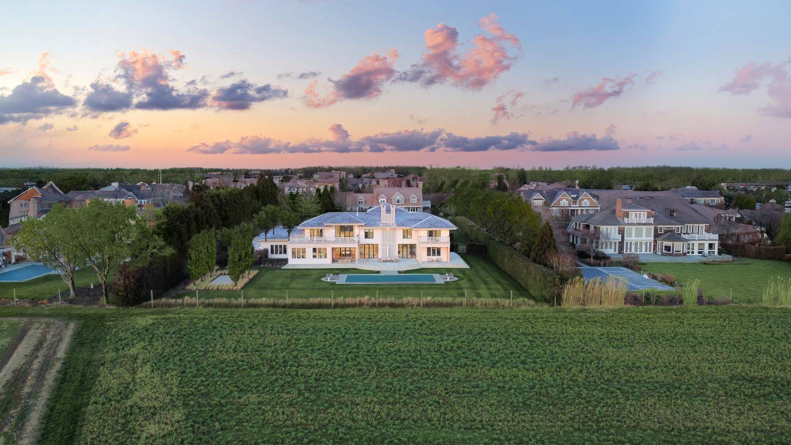 Undisclosed Address Sagaponack, NY 11962 - Photo 39 of 40 a front view of a house with a yard