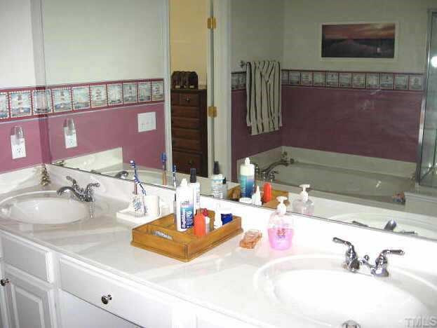7710 Elon Drive Raleigh, NC 27613 - Photo 8 of 12 Beautiful master bath with dual vanity areas, whirlpool, separate shower, water closet, & tile floor Other