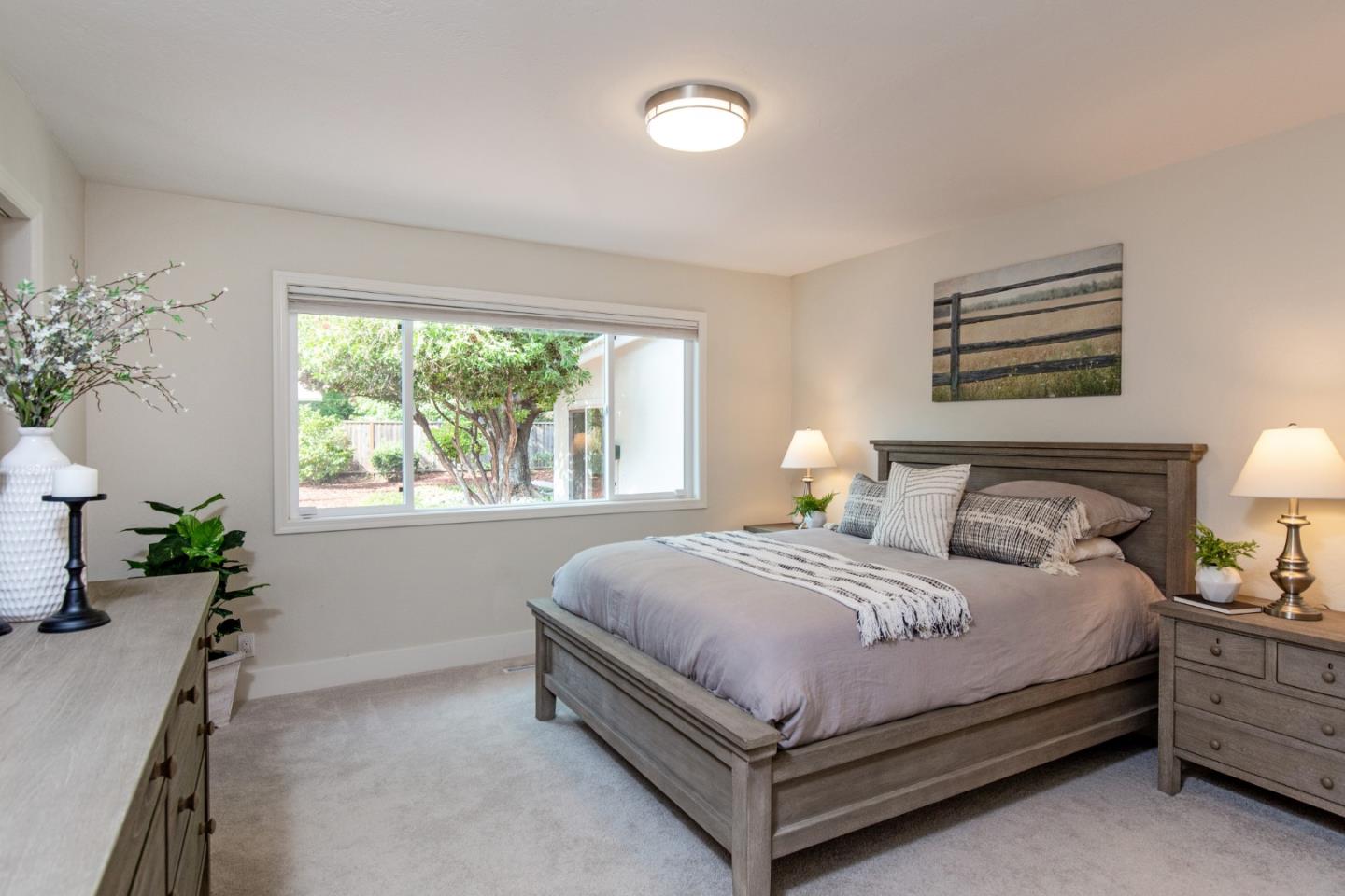 2487 Gunar Drive San Jose, CA 95124 - Photo 16 of 33 a bed sitting in a bedroom next to a window